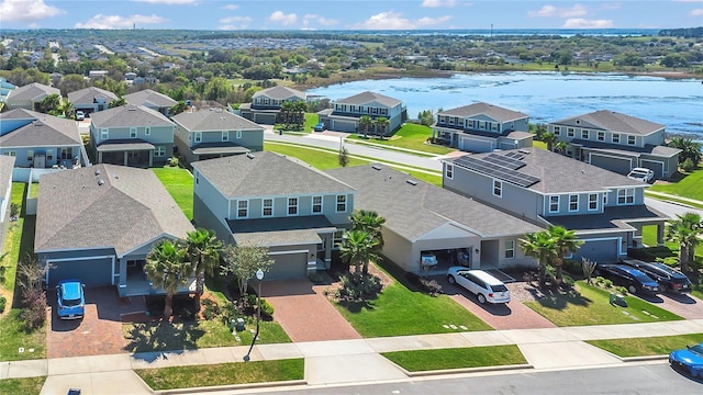 aerial view with a residential view and a water view