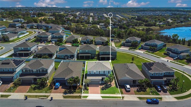 aerial view featuring a residential view and a water view