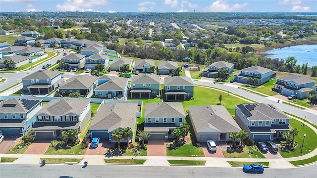 birds eye view of property featuring a residential view and a water view