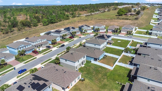 bird's eye view with a residential view and a view of trees