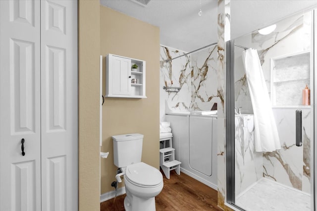 full bath with toilet, a marble finish shower, a closet, and wood finished floors