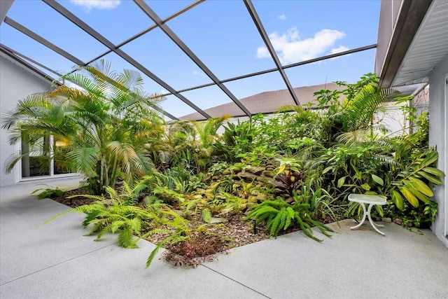 view of patio featuring a lanai