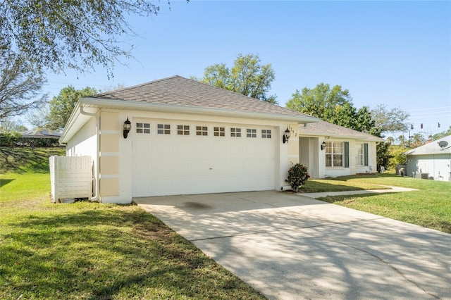 ranch-style home with stucco siding, driveway, an attached garage, and a front yard