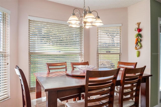 dining room featuring a notable chandelier