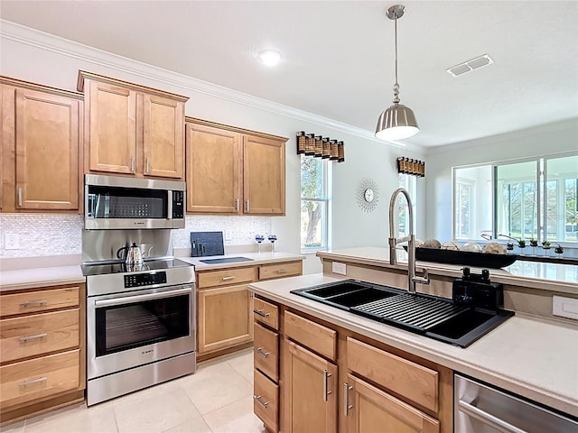 kitchen featuring a sink, visible vents, appliances with stainless steel finishes, and light countertops