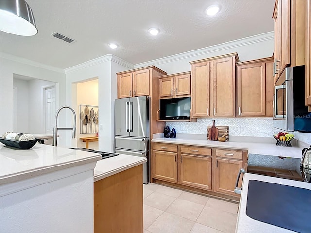 kitchen featuring light tile patterned floors, visible vents, appliances with stainless steel finishes, and crown molding