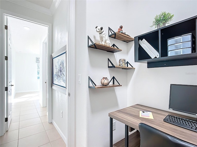 office with light tile patterned flooring, crown molding, and baseboards