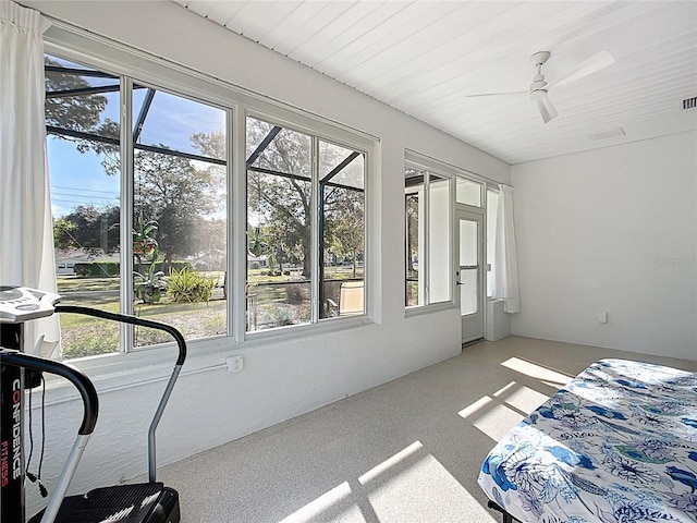 sunroom / solarium with visible vents and ceiling fan