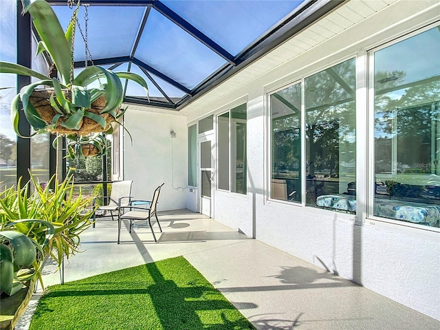 sunroom featuring lofted ceiling