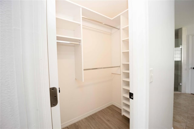 spacious closet with wood finished floors