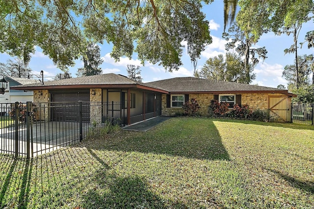 ranch-style home with a front yard, a gate, fence, driveway, and an attached garage