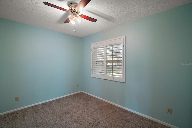 carpeted empty room with baseboards, a textured ceiling, and ceiling fan