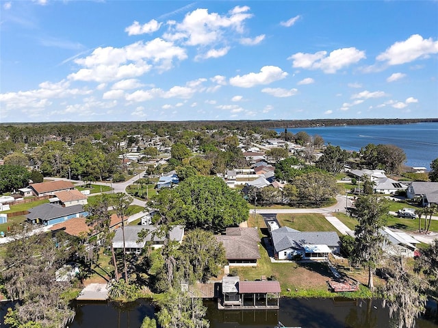 drone / aerial view featuring a residential view and a water view