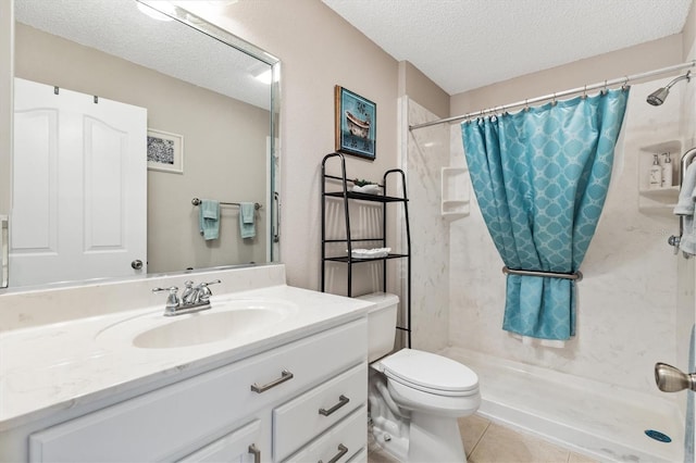 full bath with a shower stall, toilet, vanity, tile patterned floors, and a textured ceiling