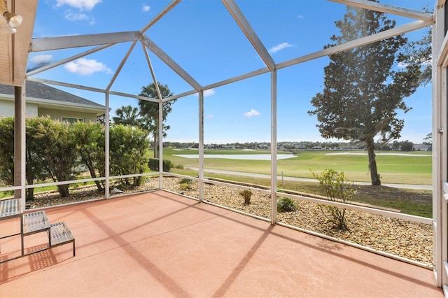 unfurnished sunroom with view of golf course