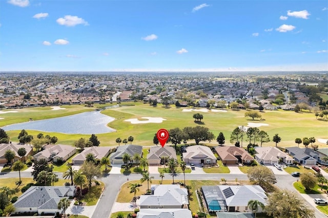 bird's eye view featuring view of golf course, a residential view, and a water view