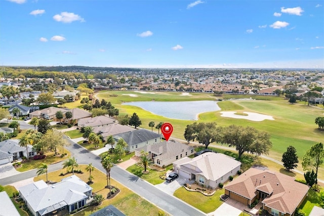 bird's eye view featuring a residential view, golf course view, and a water view