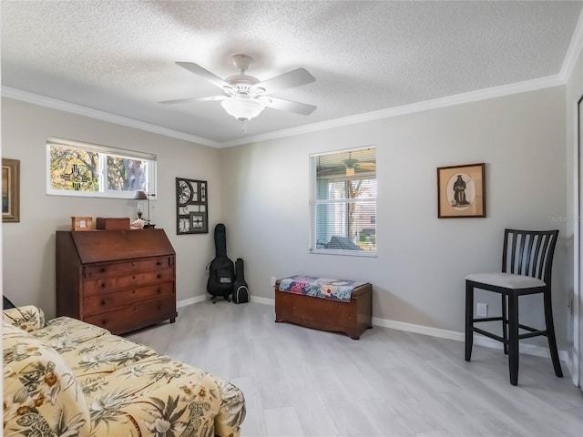 bedroom with multiple windows, light wood-style floors, and ornamental molding