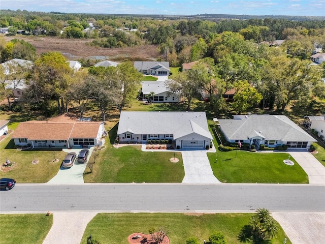 bird's eye view with a forest view and a residential view