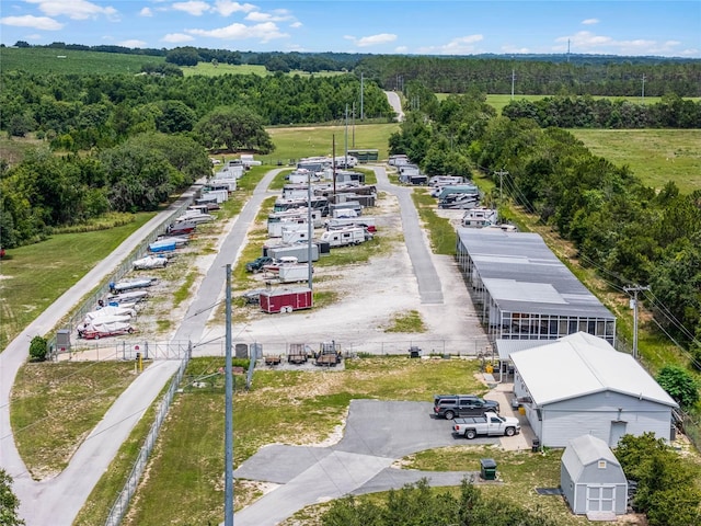 drone / aerial view with a wooded view