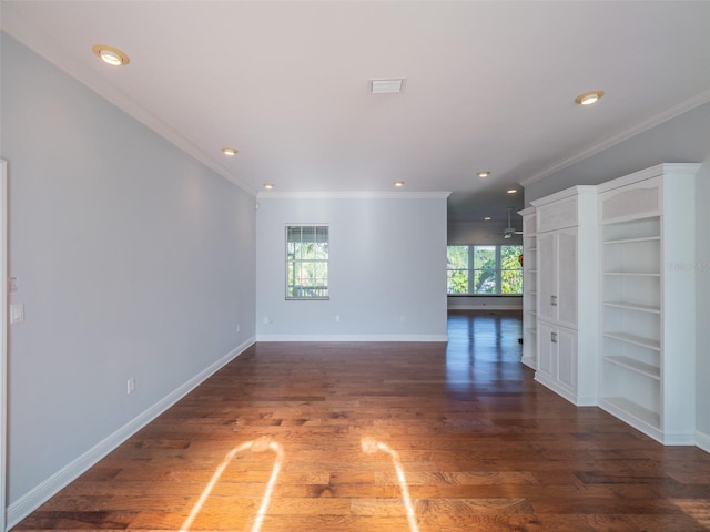 spare room featuring visible vents, baseboards, ornamental molding, recessed lighting, and wood finished floors