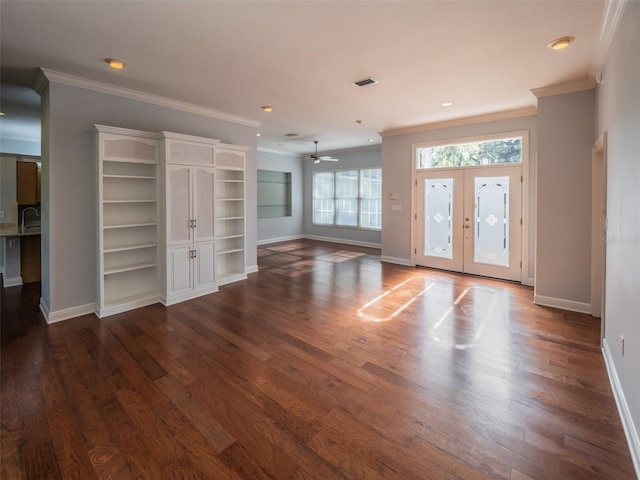 foyer featuring crown molding, visible vents, and dark wood-style flooring