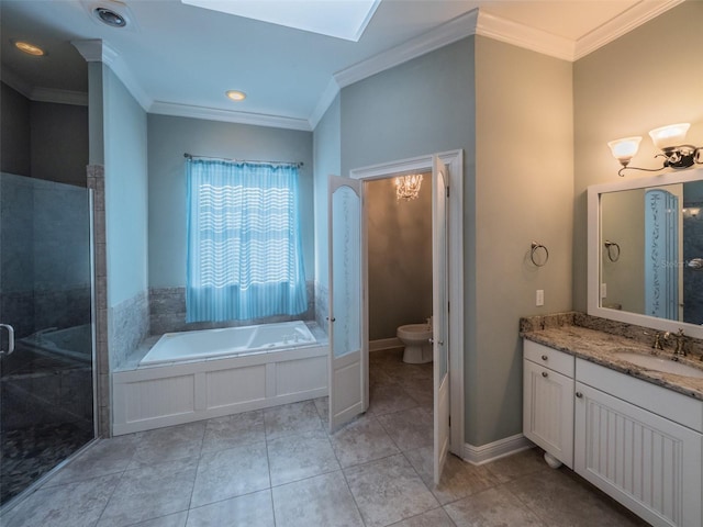 bathroom with toilet, vanity, crown molding, and a garden tub