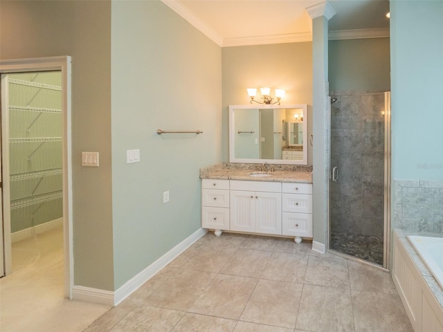 full bathroom with a stall shower, baseboards, ornamental molding, and vanity