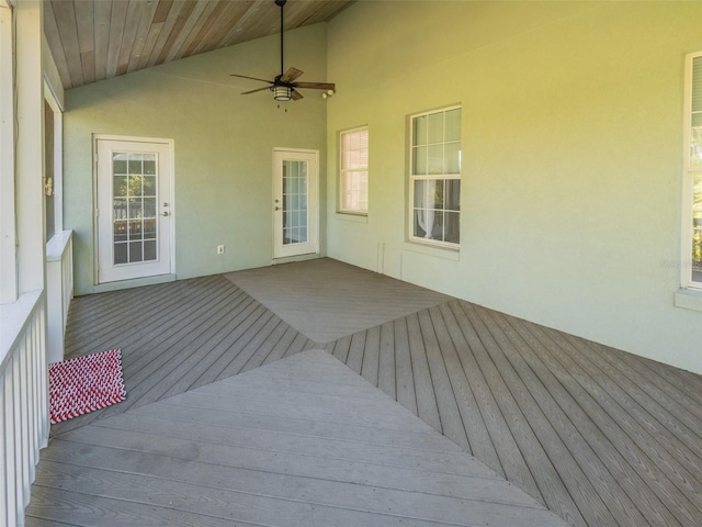 wooden deck featuring a ceiling fan