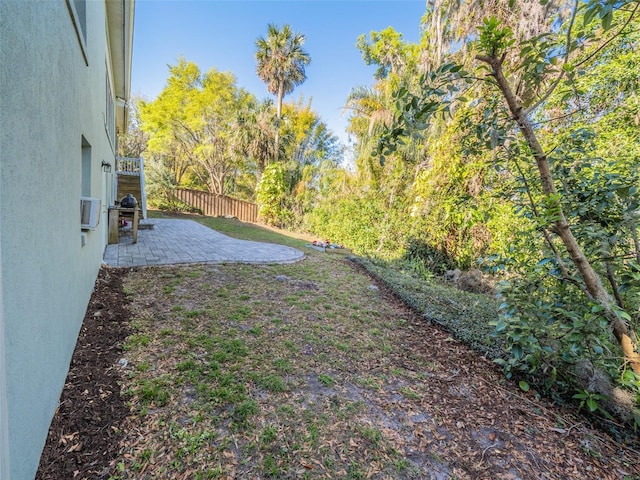 view of yard featuring a patio and fence