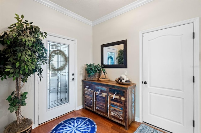 entryway with wood finished floors, baseboards, and ornamental molding