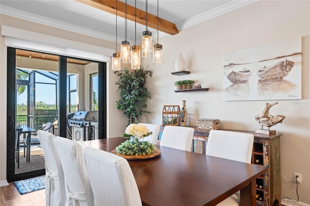 dining space with beam ceiling, crown molding, light wood-style floors, and a sunroom