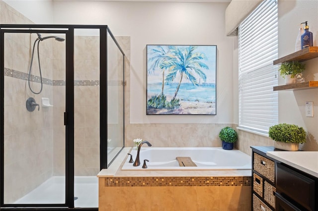 full bathroom with a shower stall, vanity, and a garden tub