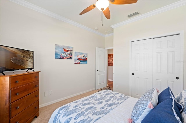 bedroom featuring visible vents, crown molding, baseboards, light carpet, and a closet