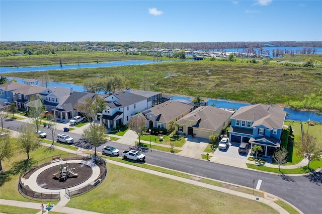 aerial view with a residential view and a water view