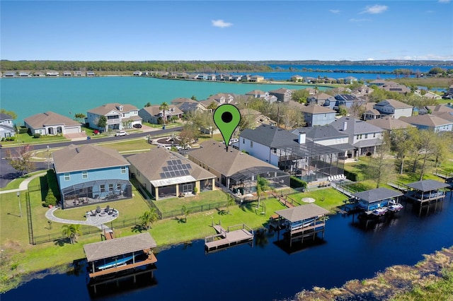 bird's eye view featuring a residential view and a water view