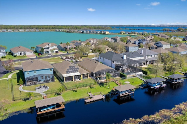 bird's eye view with a residential view and a water view