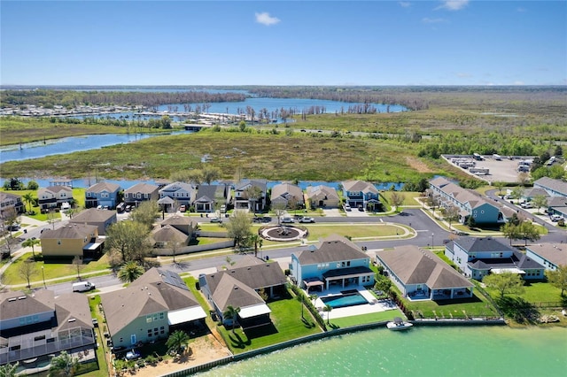 aerial view with a residential view and a water view