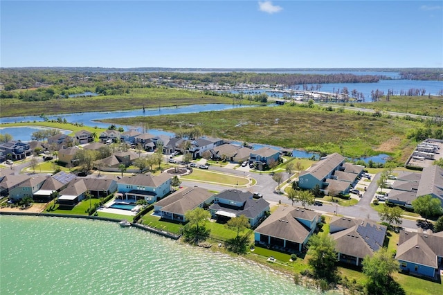 birds eye view of property featuring a residential view and a water view