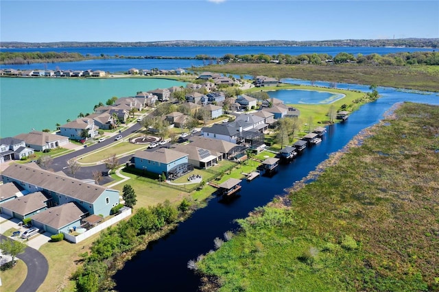 birds eye view of property with a residential view and a water view