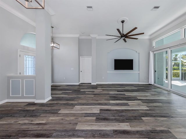 unfurnished living room featuring visible vents, crown molding, and baseboards