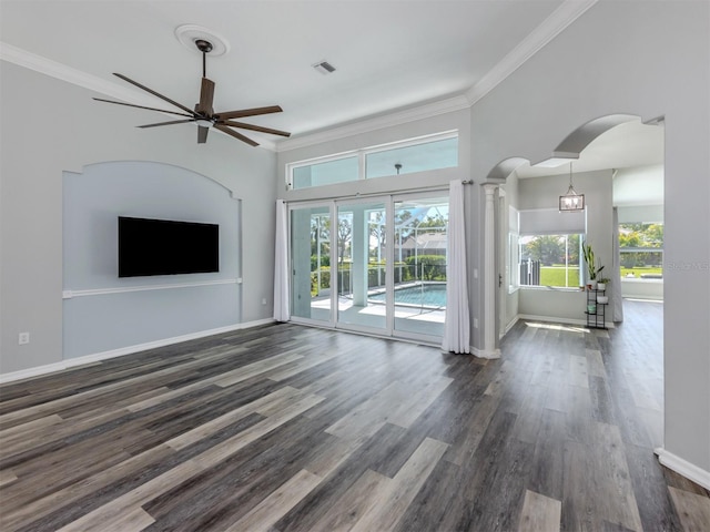 unfurnished living room featuring dark wood-style floors, visible vents, crown molding, and baseboards