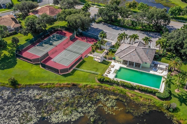 birds eye view of property with a water view