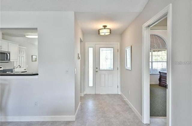 foyer with baseboards