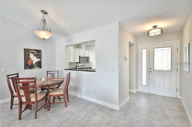 dining space with baseboards