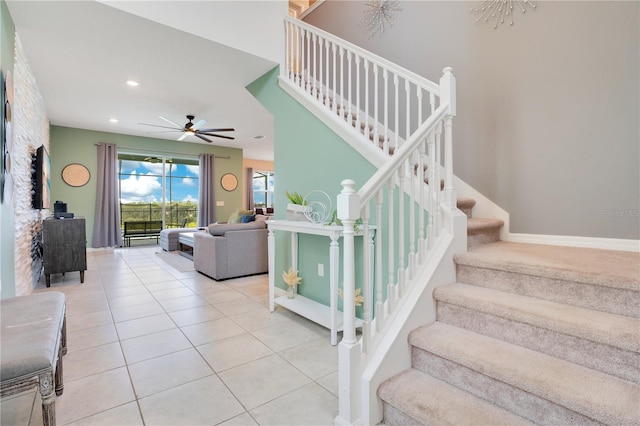 stairs with tile patterned floors, recessed lighting, baseboards, and ceiling fan