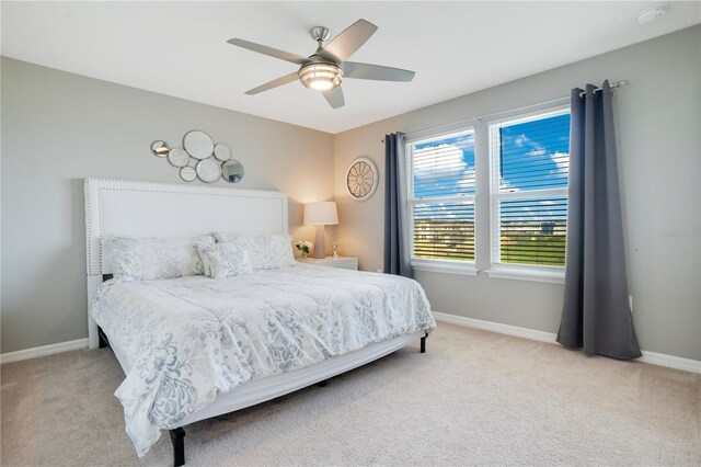 bedroom with baseboards, carpet floors, and ceiling fan