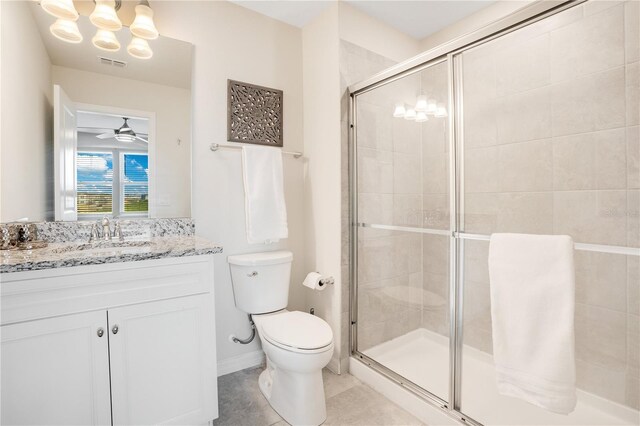 full bathroom with visible vents, toilet, a stall shower, tile patterned floors, and vanity