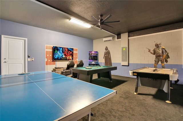 game room with billiards, electric panel, a textured ceiling, a wall unit AC, and concrete block wall