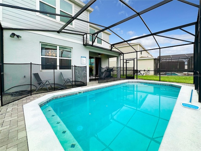 outdoor pool featuring a patio and a lanai